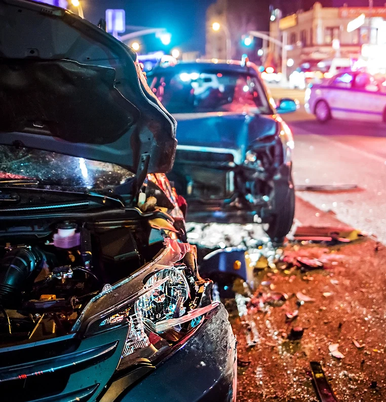 A car with front damage and an open hood, revealing the engine compartment
